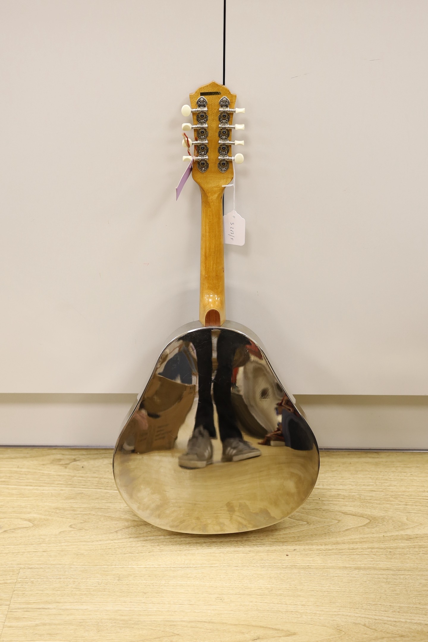 An Ashbury mandolin ‘Resonator’ with fitted, padded case, mandolin 69 cms high.